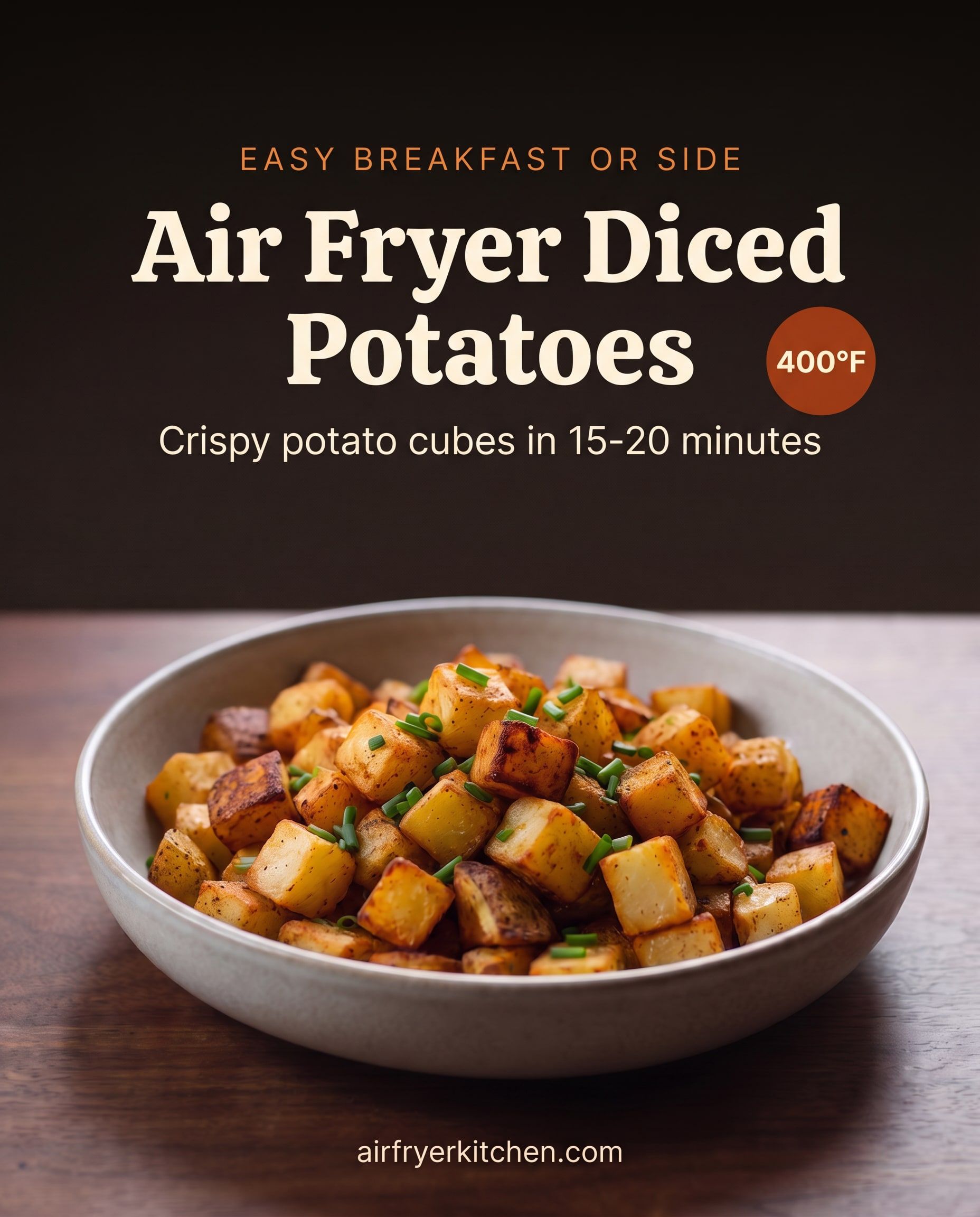 A bowl of crispy golden diced potatoes with paprika and chives, with the text Easy breakfast or side, Air Fryer Diced Potatoes, crispy potato cubes in 15-20 minutes, 400°F.