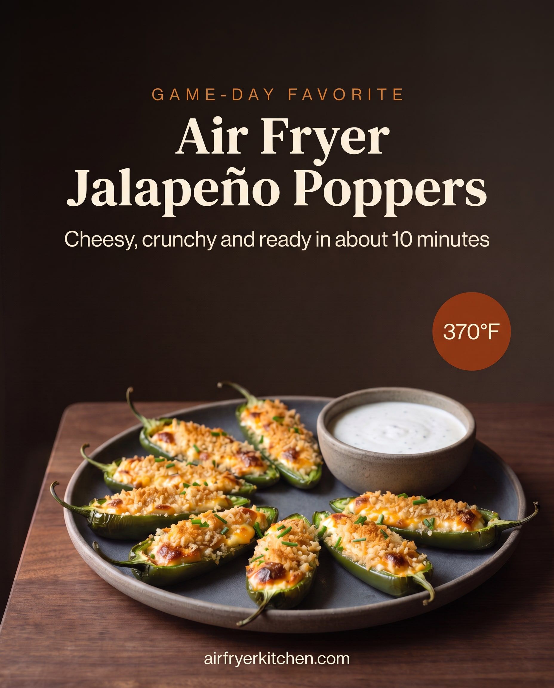 Cream cheese jalapeño poppers with a golden panko topping on a dark plate with a bowl of ranch, with the text Game-day favorite, Air Fryer Jalapeño Poppers, cheesy, crunchy and ready in about 10 minutes, 370°F.
