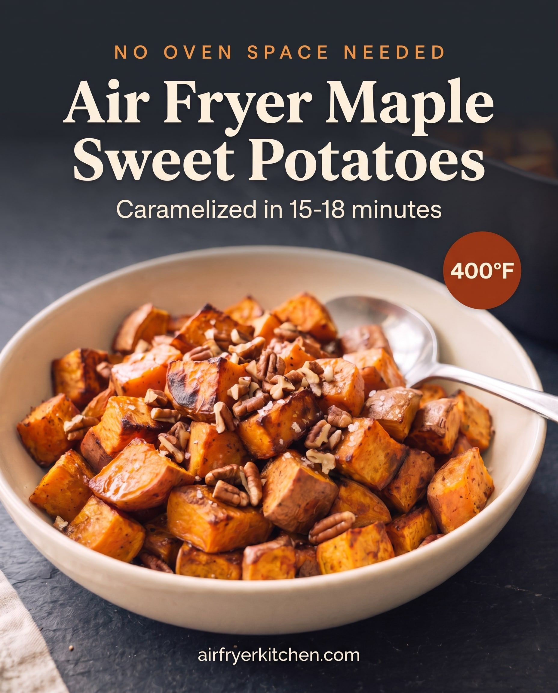 A cream bowl of caramelized maple sweet potato cubes topped with toasted pecans and flaky salt, with the text Air Fryer Maple Sweet Potatoes, caramelized in 15-18 minutes, 400°F.
